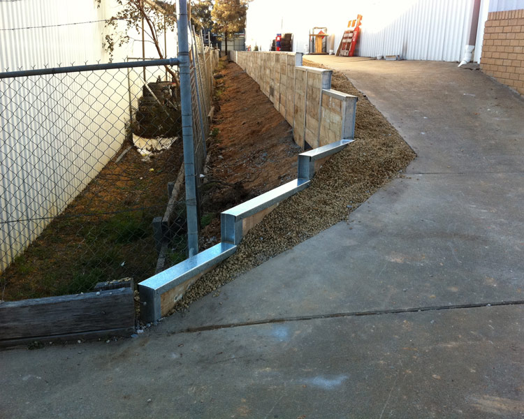 Retaining wall stepped down slope