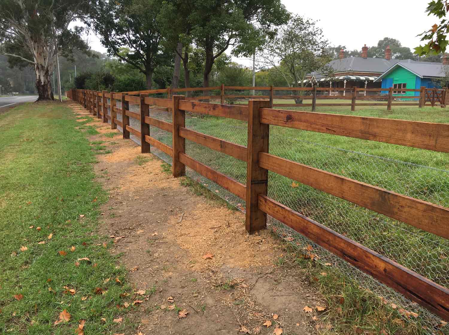 Post and 3 rail fencing with mesh